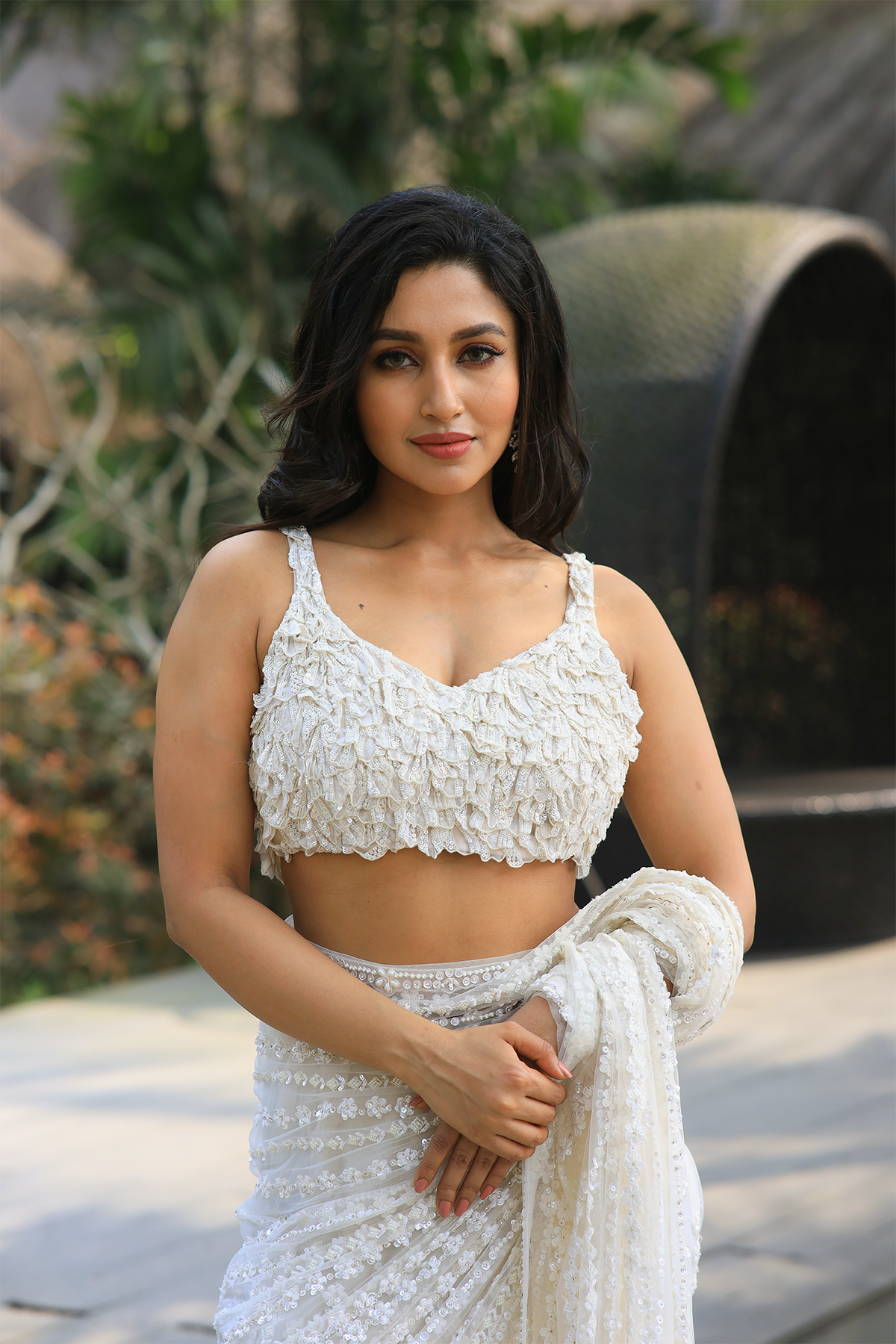 Off-white net embroidered Saree with sleeveless embroidered blouse