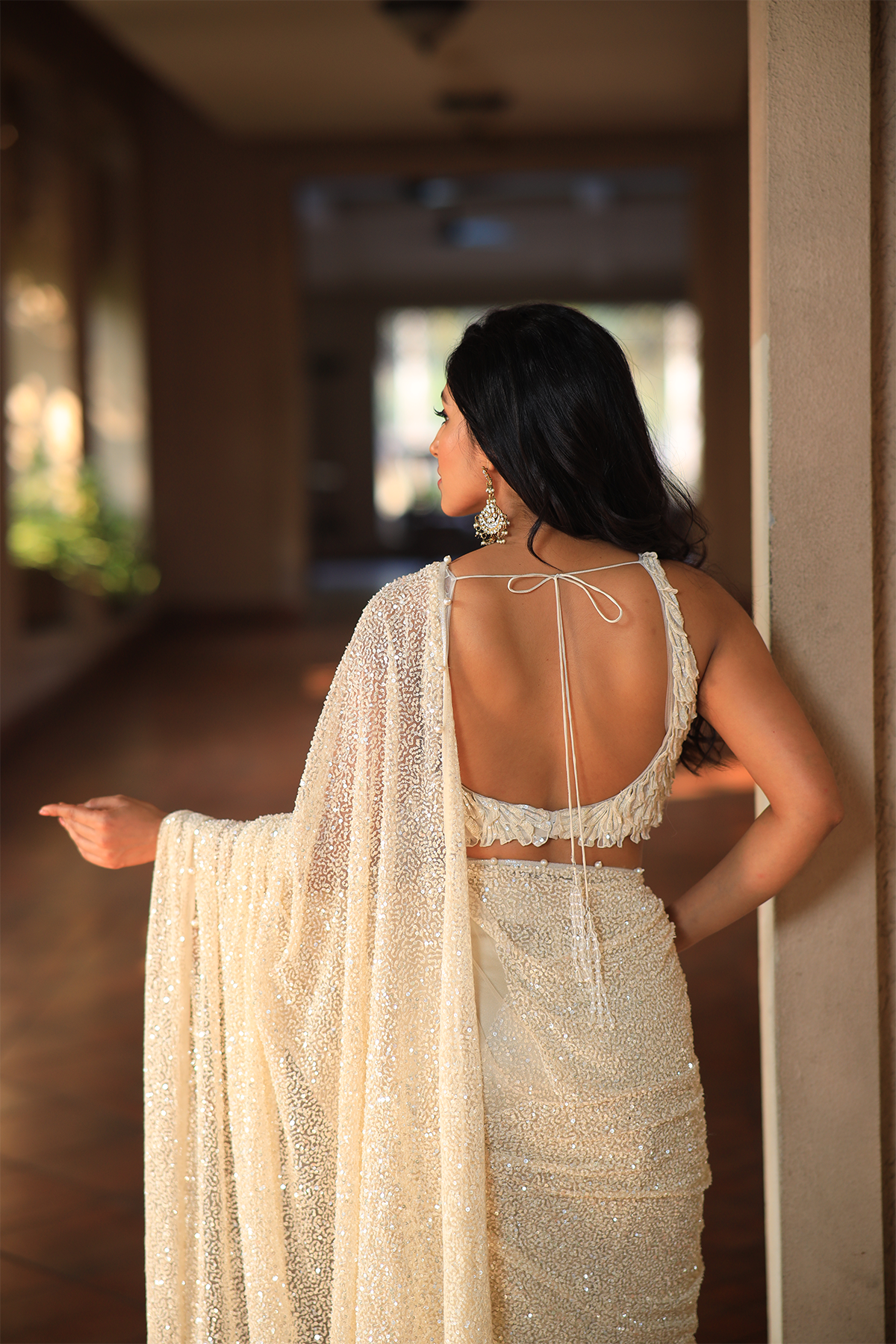 Off white net embroidered Saree with statement sleeveless blouse