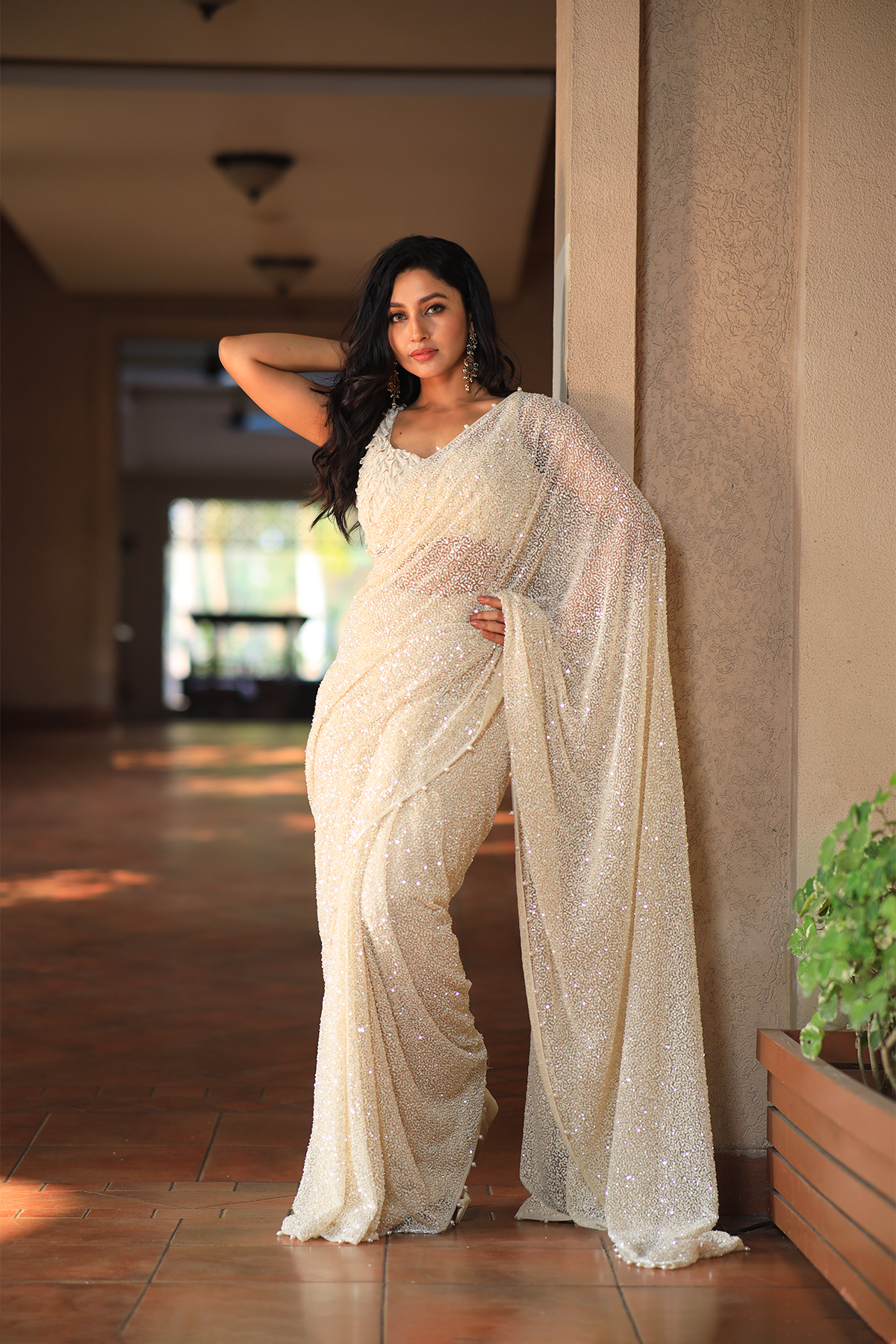Off white net embroidered Saree with statement sleeveless blouse