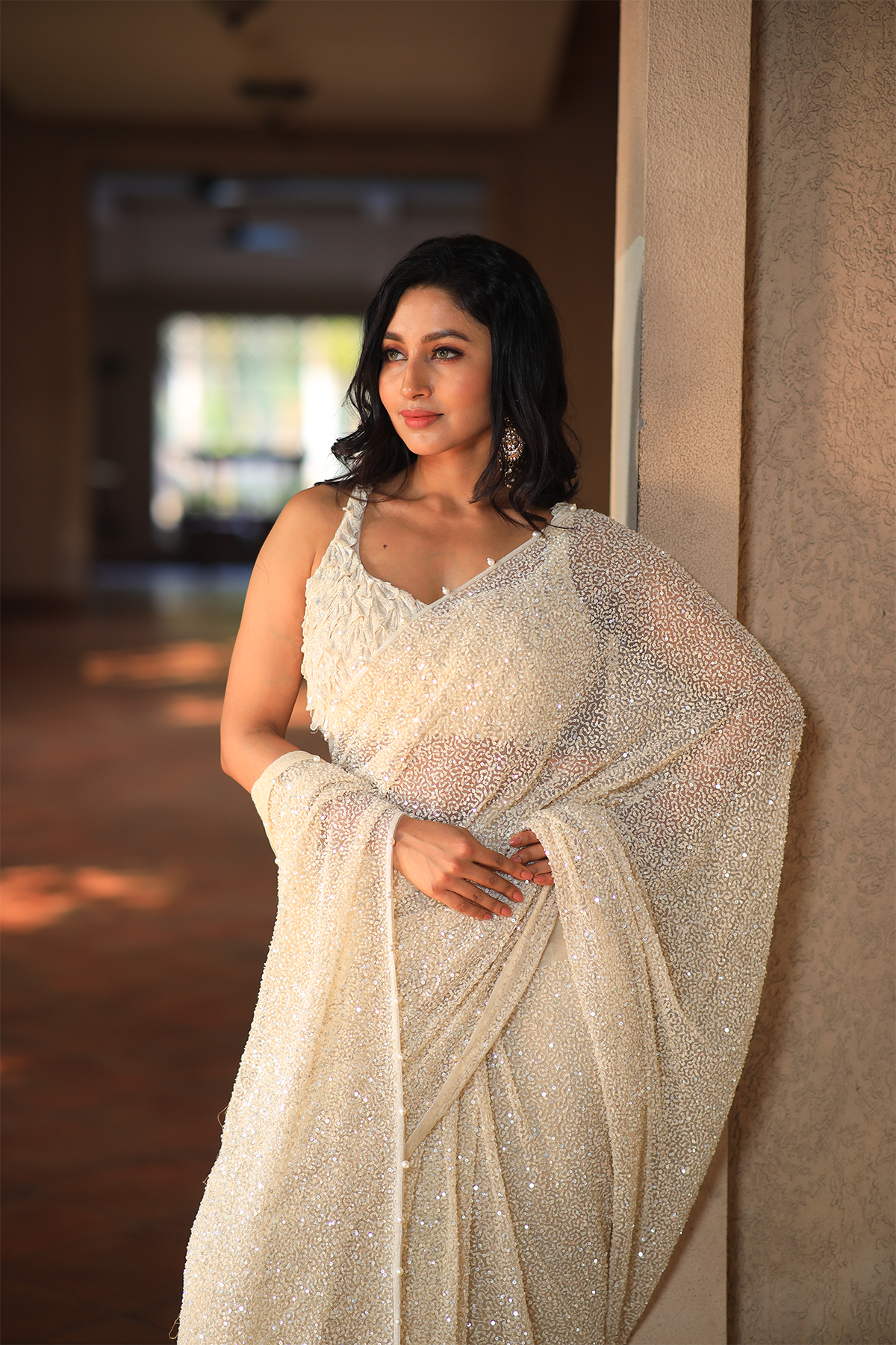 Off white net embroidered Saree with statement sleeveless blouse