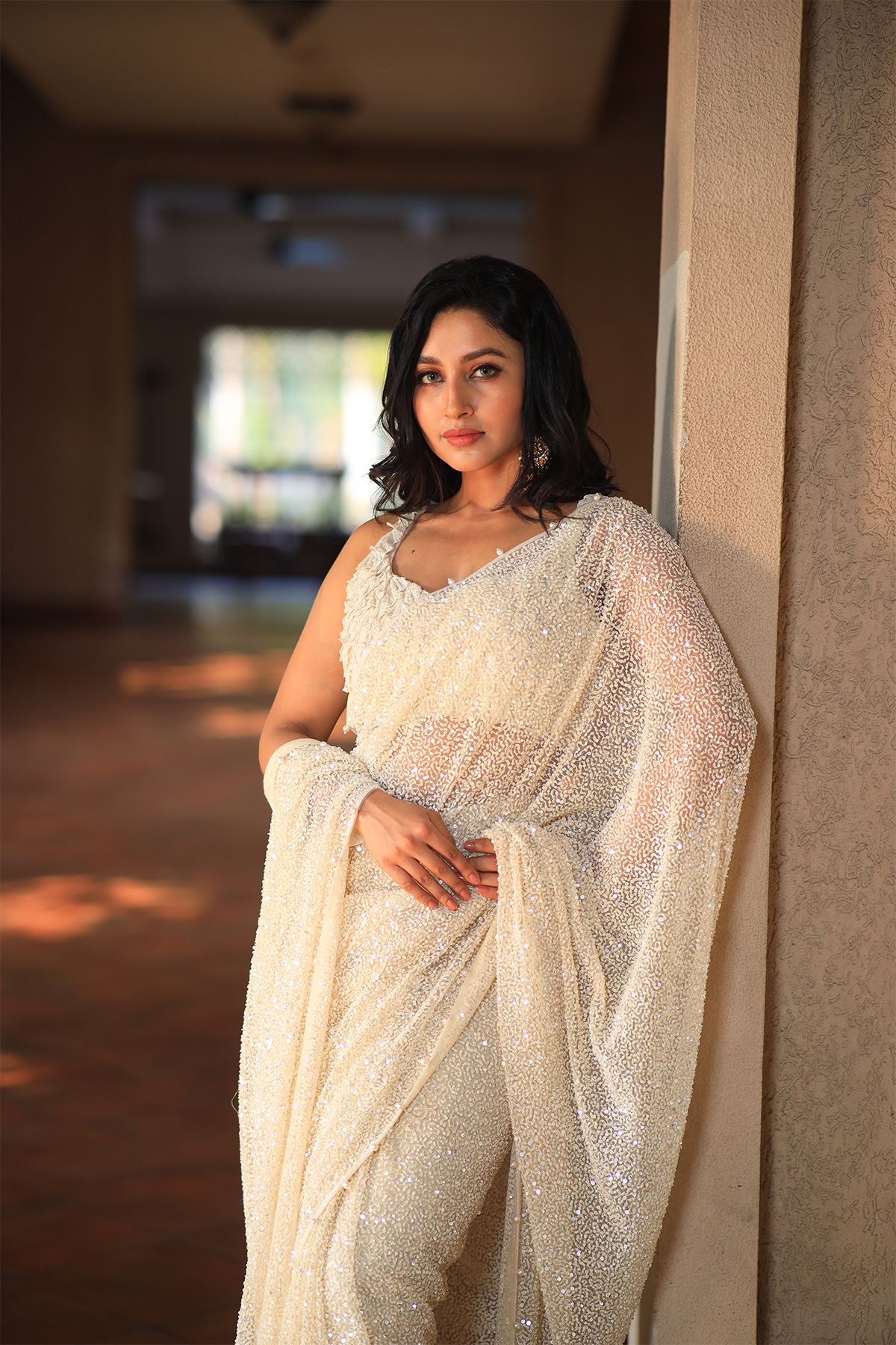 Off white net embroidered Saree with statement sleeveless blouse