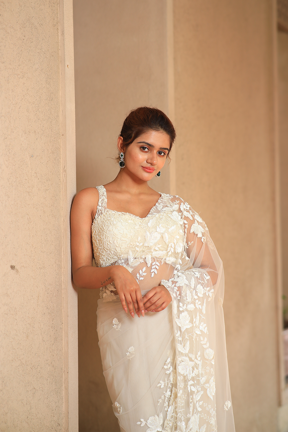 Off-white net embroidered Saree with sleeveless blouse