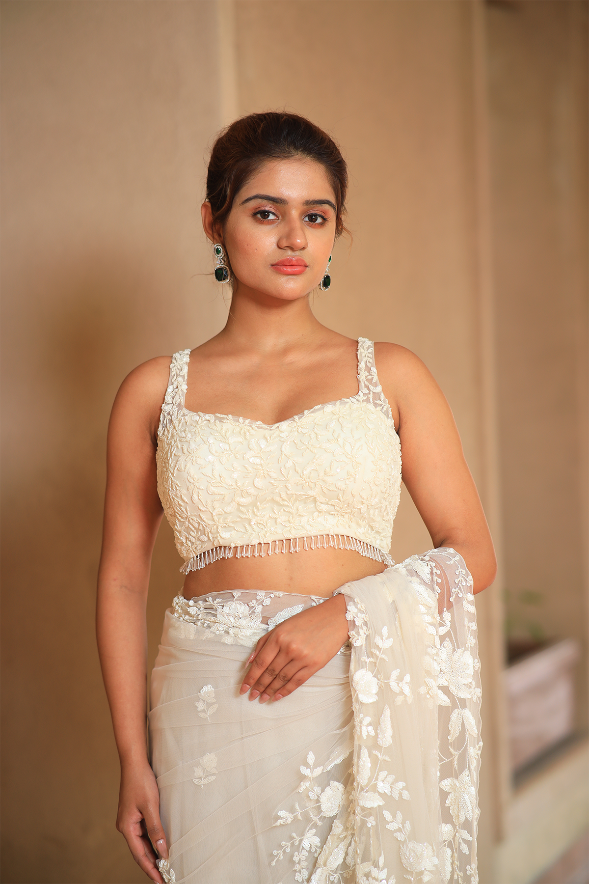 Off-white net embroidered Saree with sleeveless blouse