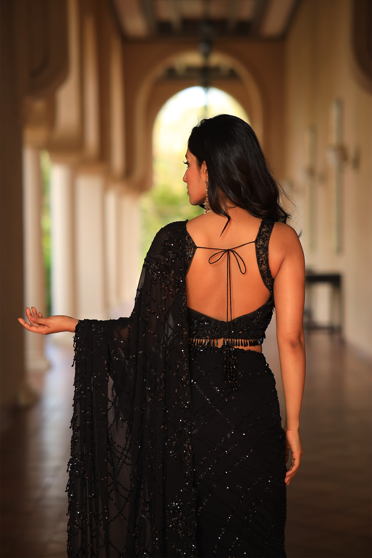 Black georgette embroidered Saree with sleeveless blouse