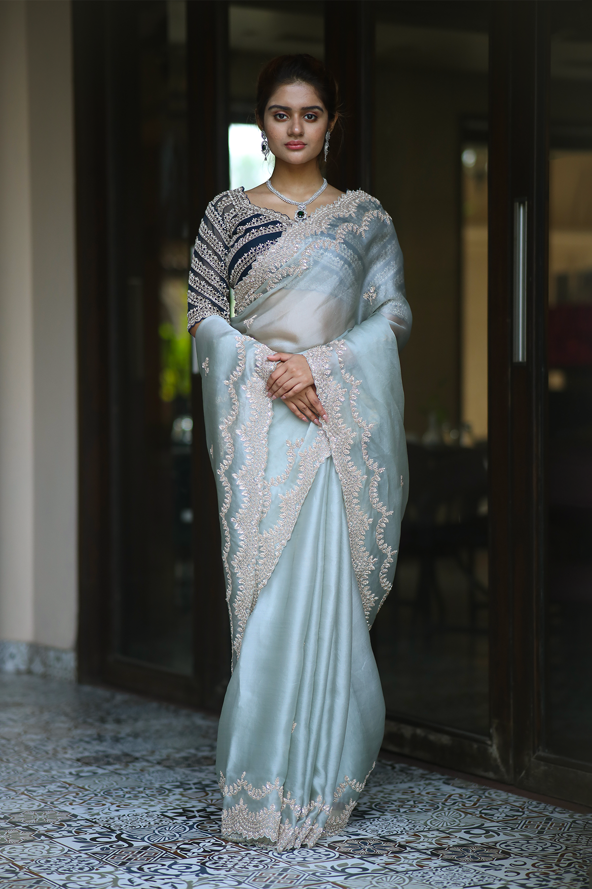 Powder blue silk organza embroidered Saree with elbow sleeve embroidered blouse