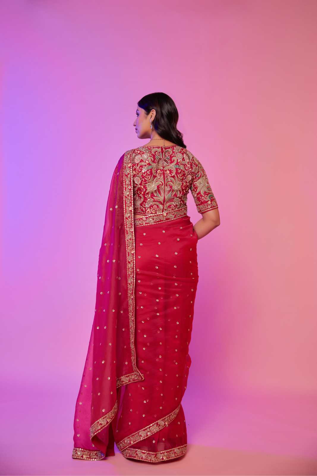 Rani pink silk organza embroidered Saree with multi-color elbow sleeve blouse