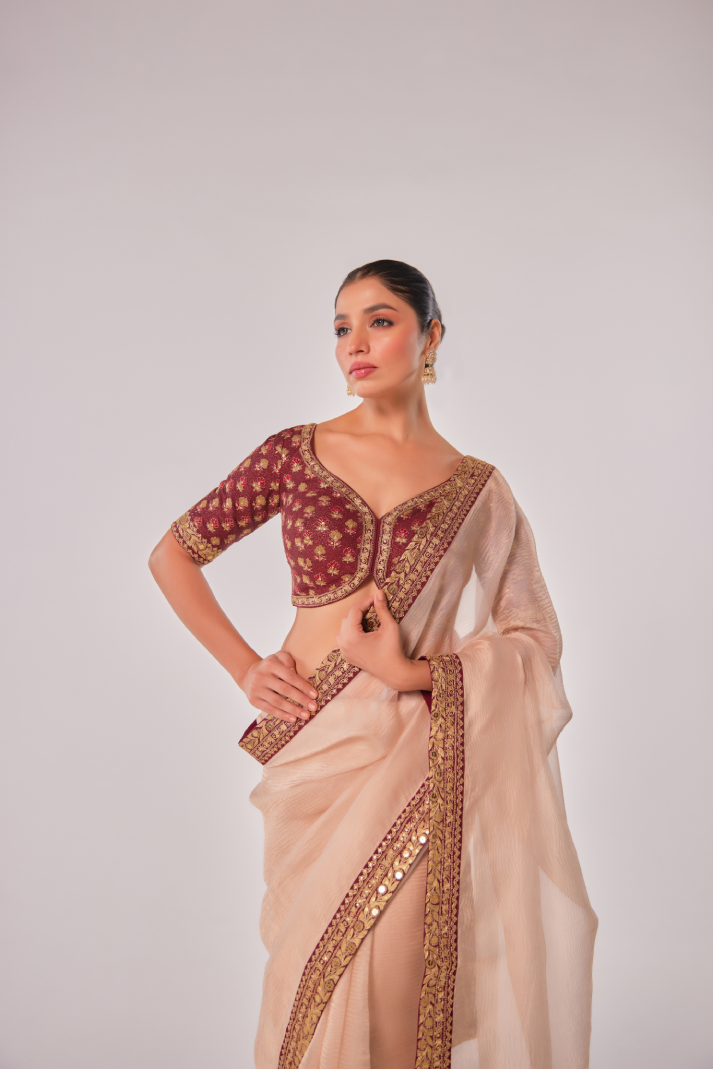 Gold hued peach crush tissue embroidered Saree with elbow sleeve blouse