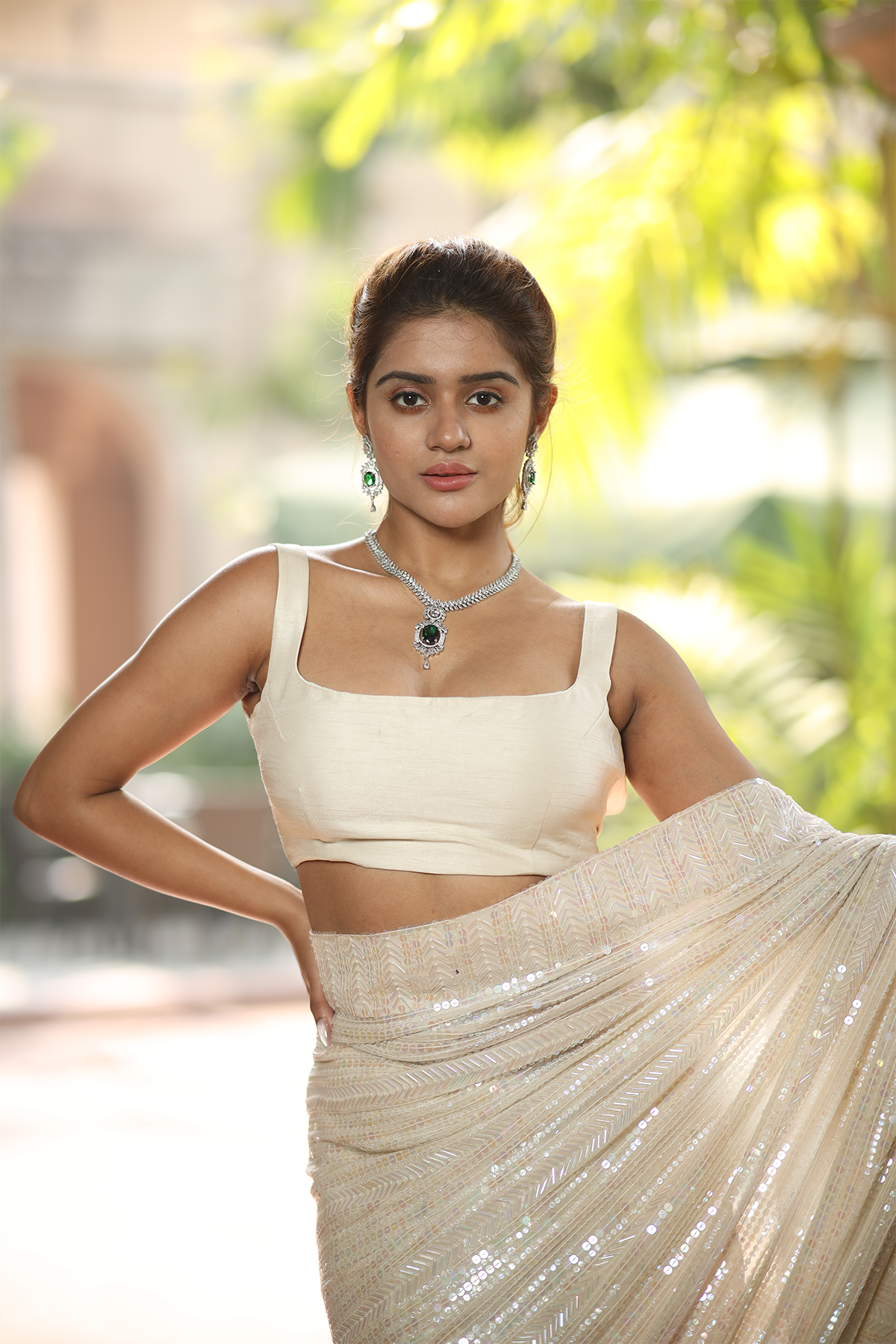 Off-white georgette embroidered Saree with sleeveless raw silk blouse