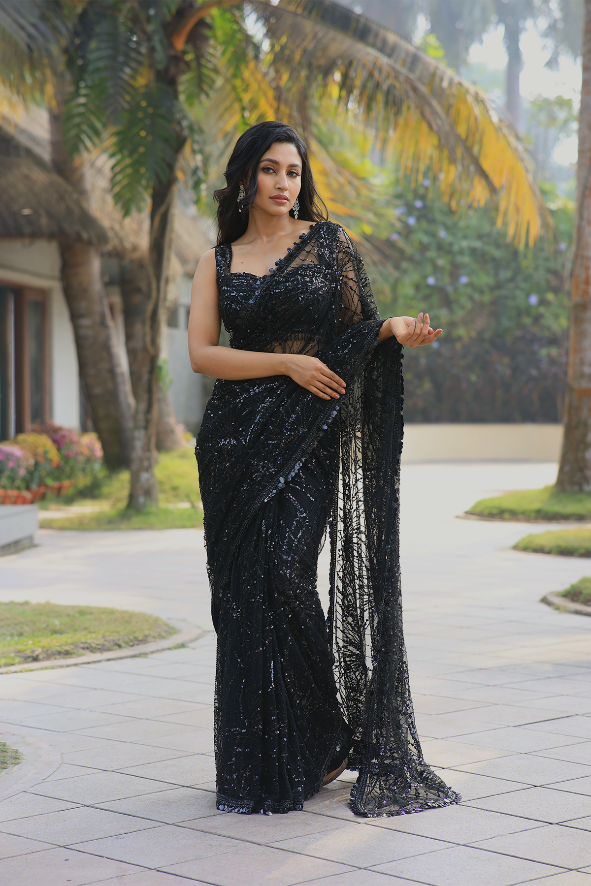 Black net embroidered Saree with sleeveless embroidered blouse