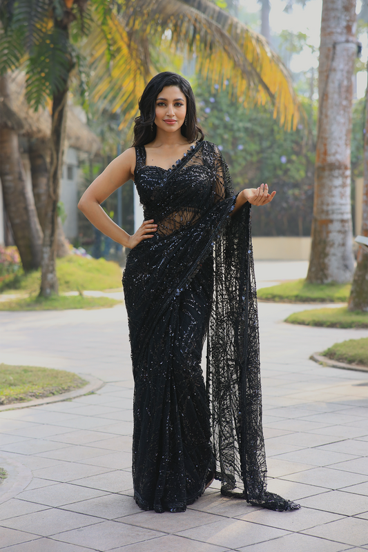 Black net embroidered Saree with sleeveless embroidered blouse