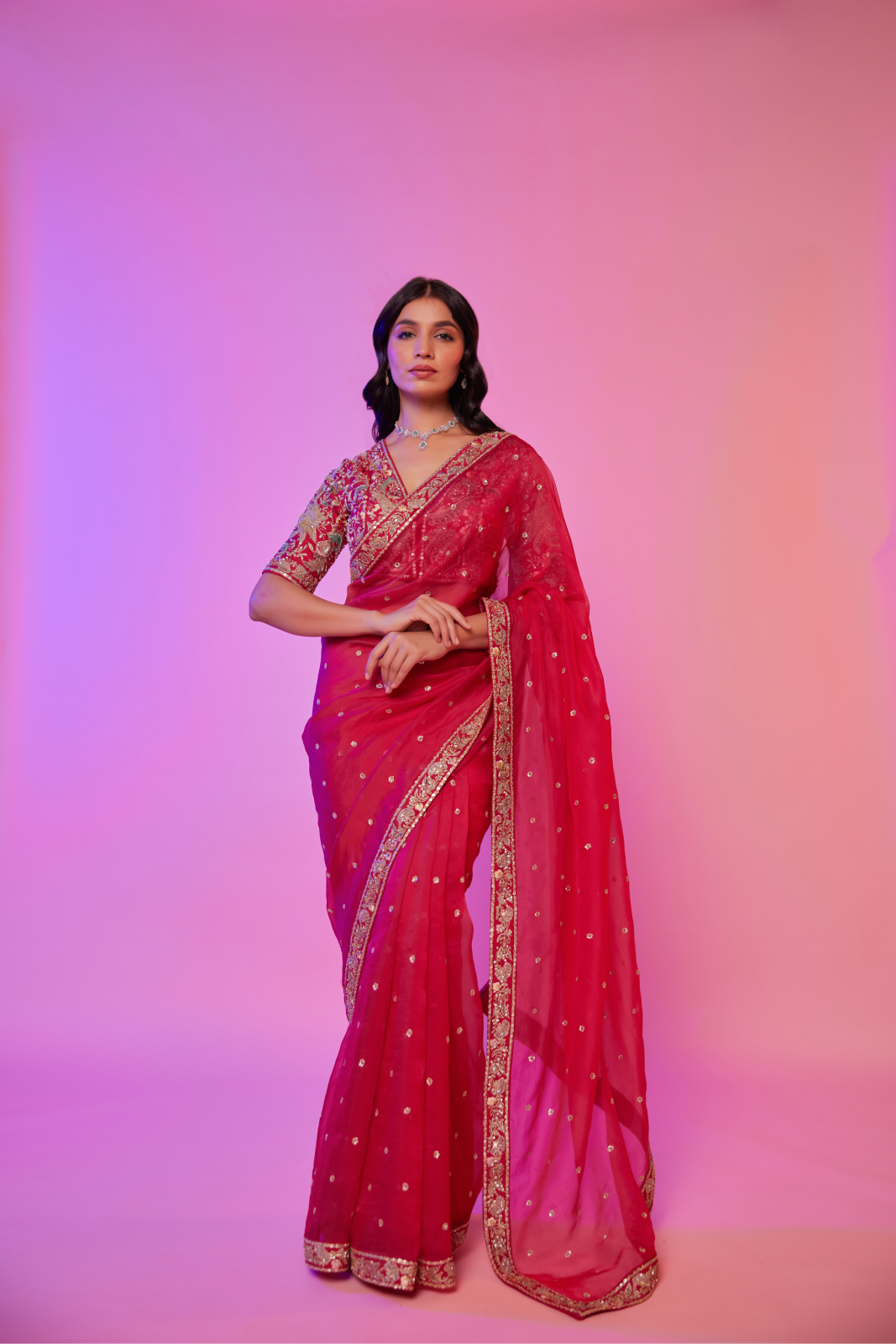 Rani pink organza embroidered Saree with multi-color elbow sleeve blouse