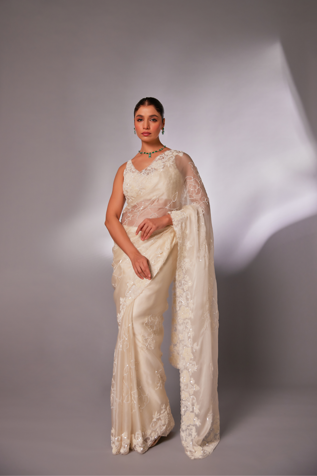 Off-white silk organza embroidered Saree with sleeveless blouse