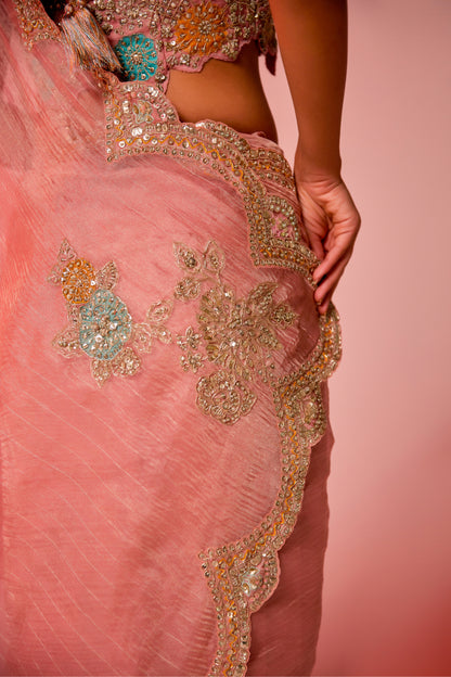 Gold hued pink crush tissue multi-color embroidered Saree with sleeveless blouse