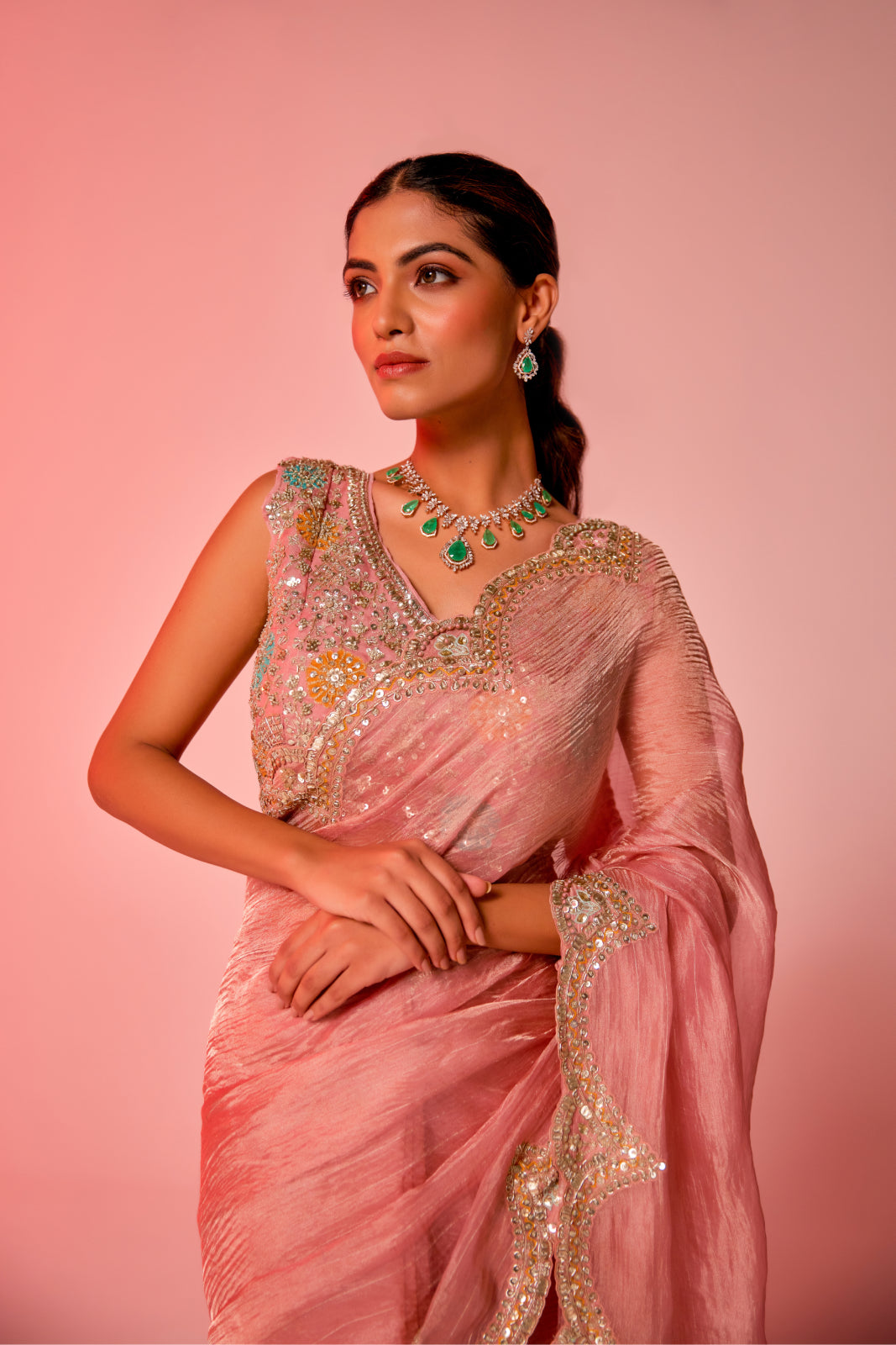 Gold hued pink crush tissue multi-color embroidered Saree with sleeveless blouse