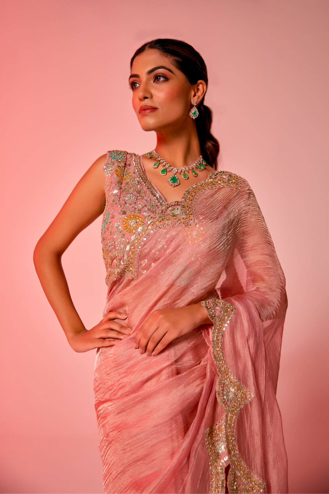 Gold hued pink crush tissue multi-color embroidered Saree with sleeveless blouse